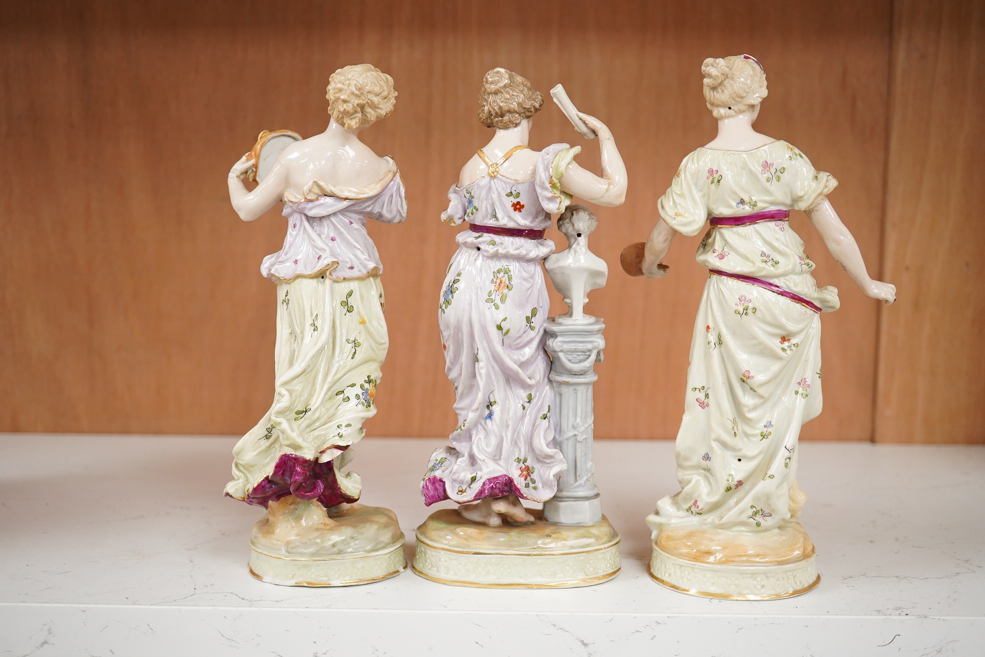 Early 20th century German figural pottery; The Three Graces, tallest 21.5cm high. Condition - restored